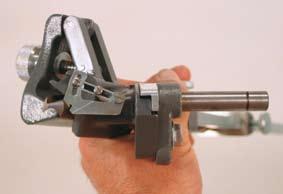 plunger. Tighten the bushing just enough so that the drill holder assembly can freely pivot in the bushing. IX.
