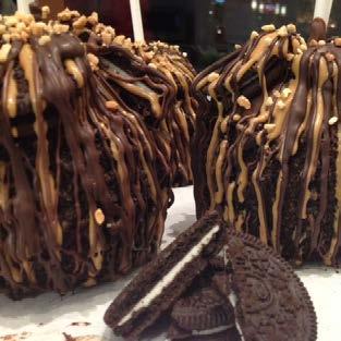 DLR Featured Treat January s gourmet apple has been covered in caramel, rolled in crushed chocolate sandwich cookies and drizzled with peanut butter.