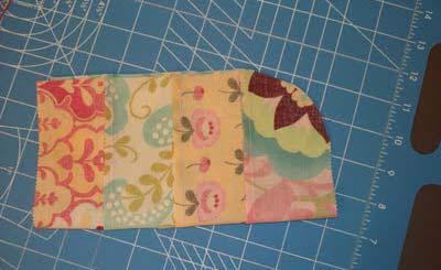 ) Cut the strip of four sewn strips into 4-8 inch squares and 1 8 x 9 inch square.
