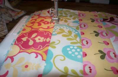 Make this into a quilt sandwich by ironing the front fabric to one side and the back fabric to the other side.