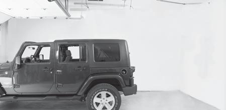 Plan to position object above Jeep with clearance to open garage door.