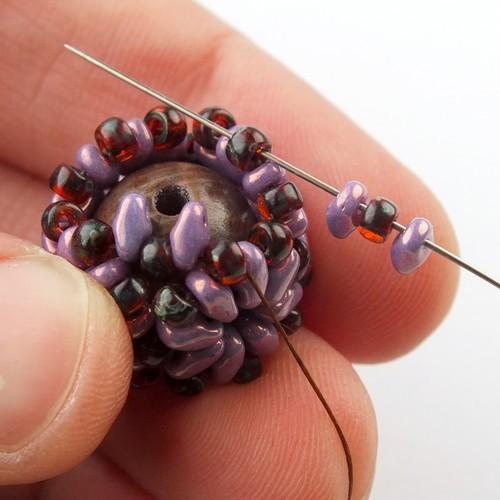21) Now weave through beads to get to