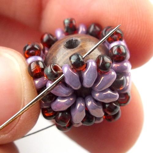 29) Weave through beads to get to the other side of the