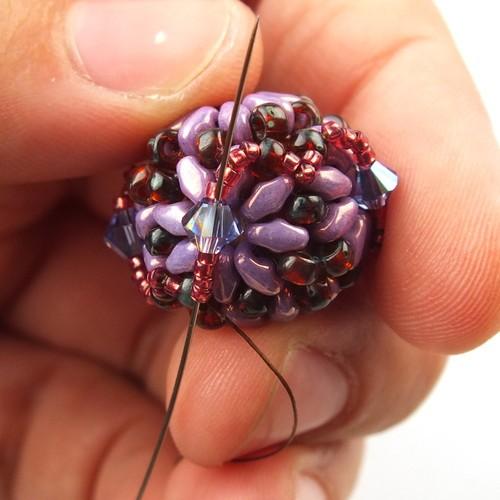 37) Weave through beads to get to one