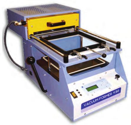 16 (d) (i) A vacuum forming machine is shown below.