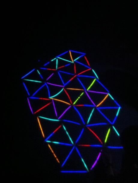 Now the kids clear the floor of sticks, and lay the glowsticks in a new lattice of equilateral triangles. 6. You can turn the lights back on while they work, then do the reveal, or leave them off.