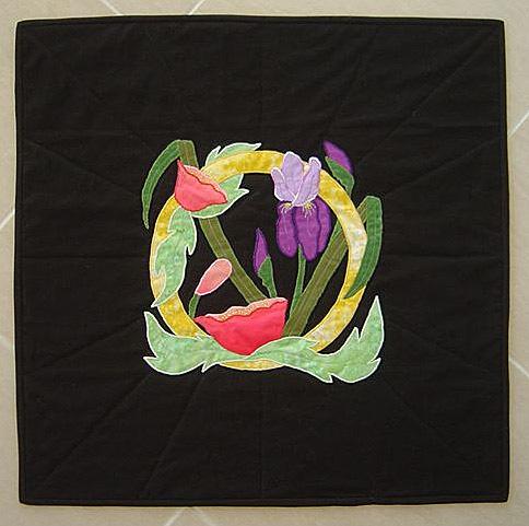 "Ring of Spring" Quilted Wallhanging This striking floral wallhanging will be sure to add a touch of Spring to your wall.