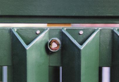 The door is retained by a tamper resistant slam latch, with a shrouded triangular operating spindle, which needs a special key to open it.