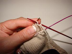 between the needles, slip one, and purl