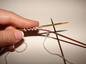 Repeat these wraps under the cable and over the needle until you have 12 wraps on the needle and 12 on the cable. Do not count the slip knot!