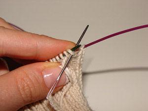 21 of 23 Turn back and insert the needle knitwise through the