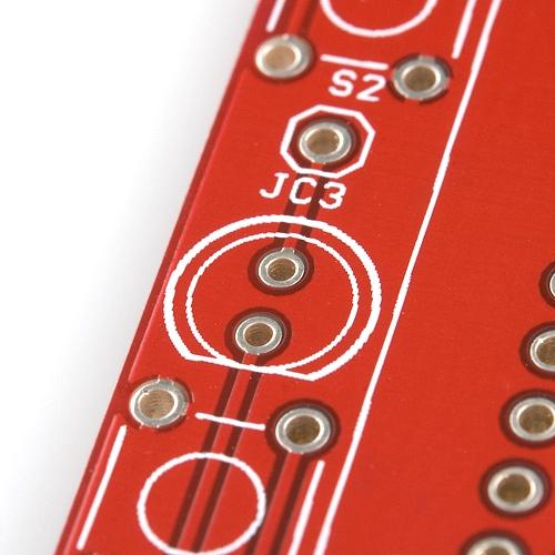 Insert the LED, making doubly-sure that the smaller leg is inserted in the hole nearer the flat part of the semi-circle.
