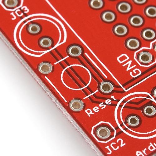 Line up the four legs of the button with the four holes on the PCB. It can fit in two different directions, and it doesn't matter which one you choose.