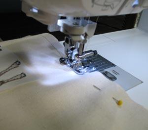 Sew a 1/2 inch seam along the pinned edges.