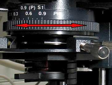 Close the aperture diaphragm by turning the wheel in the condenser until the aperture is about 80% of the diameter of the objective pupil. Replace the eyepiece.