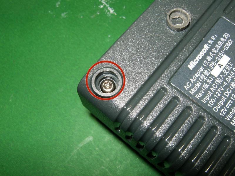 The next two images are from a 150W PSU. It appears to be a Torx screw with a center pin.