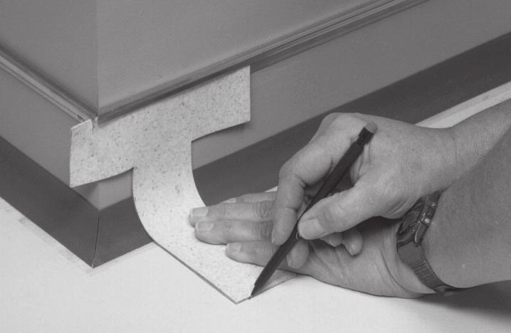 Scribe door trims with the dividers and mark the side of the trim with template #1 (Fig. 5).