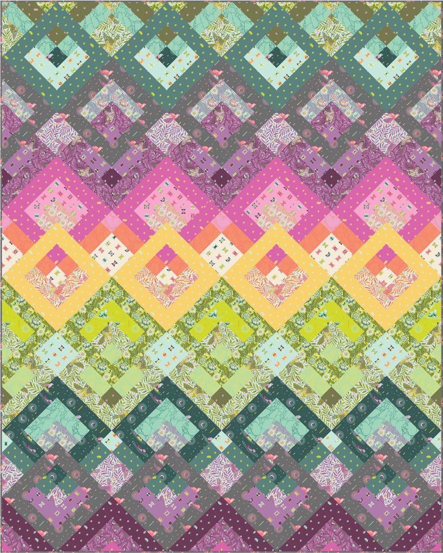 Featuring pirit Animal by Tula Pink locks of color highlight this fun quilt and you can follow them from top to bottom!