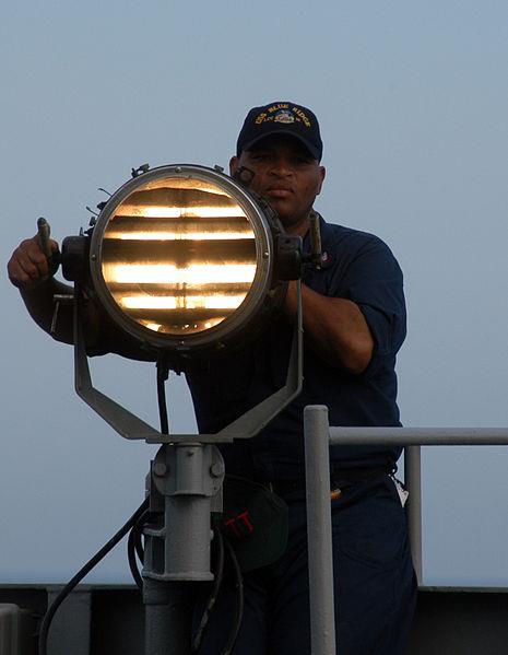Morse Code (continued) Morse code can also be transmitted using light as shown in the picture to the left in which a U.S. Navy seaman sends Morse code signals in 2005.