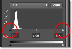 Step 9: Drag The Black And White Point Sliders The controls for the Levels adjustment layer appear in Photoshop s Properties panel.