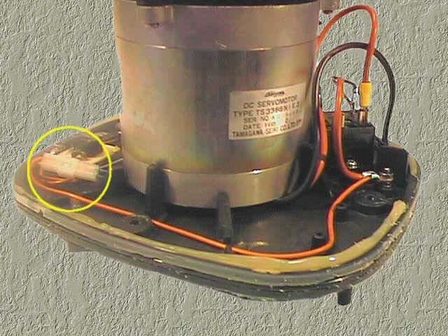 The red wire from the motor is unclipped from the relay box.