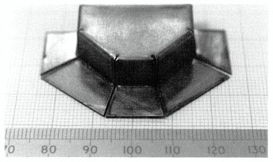 The component shown in Figure 9 was formed from both sides, the flange sections were formed up to 90 degrees from flat pre-cut sheet.