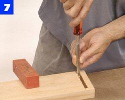 Use a sharp chisel to square the mortise ends. Since cedar is so soft, hand pressure is sufficient to cut the wood. Use a dado blade to cut the chair rear-rail tenons.