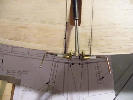 the flap horn and bend to fit 243) Epoxy the delrin bushing to the