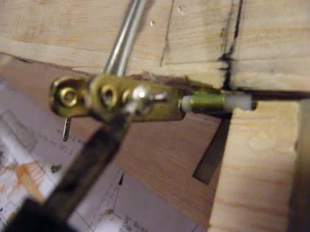 epoxy inside the bushing where the wire is 244) Slide the flap pushrod