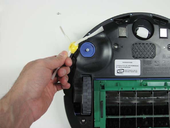 3.1.2 Once the screw is removed, you can grab the side brush by any two of its three