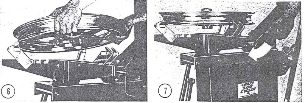 6. Place tire and wheel on the table lap from the screw operated side and slide forward until the rim slides under the