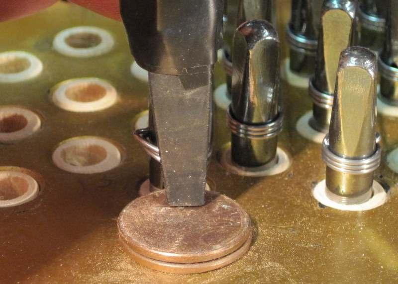 The depth gauge at the initial pounding in should be about the thickness of two pennies (inserted
