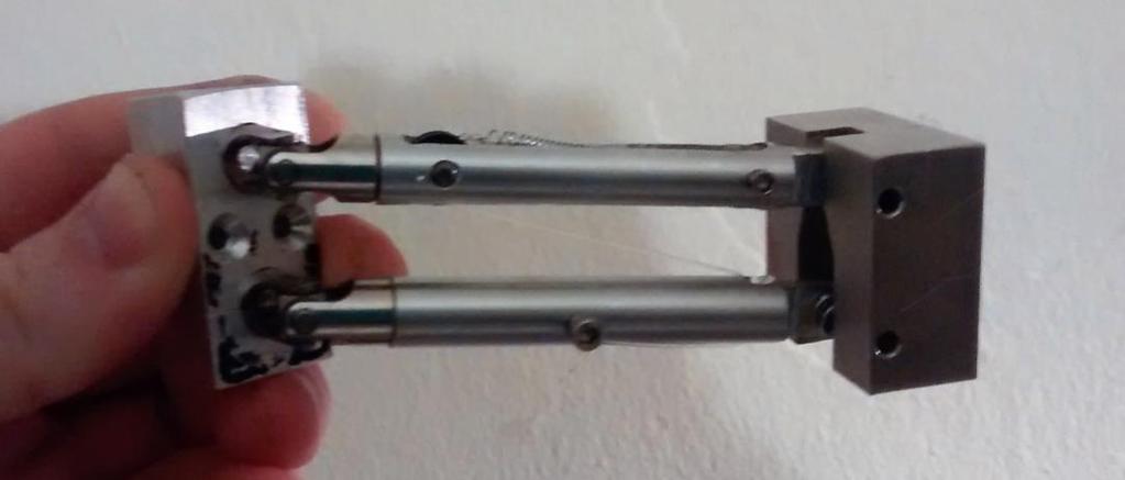 Figure 5: The universal joints at the left are mounted at a 15 downward angle. The slot on the right is wider at the base to allow the planned horizontal motion.