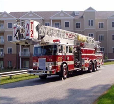 Truck - a vehicle designed to carry a compliment of ground ladders