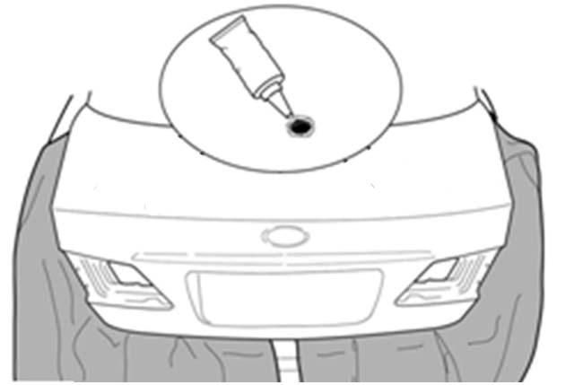(d) Place the spoiler onto the trunk lid and carefully position it so that it is centered left to right on the
