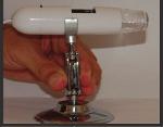 3. Insert the small ball on the microscope's dowel between the top parts of the side holders. 4. Tighten the screw. 2.