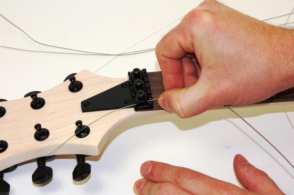 To get access on them easily you can push down the vibrato arm a little with your left hand.
