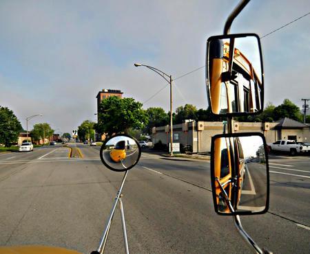 The operator is left with an array of mirrors to look at when operating the bus which can look like the attached photo Figure 9.