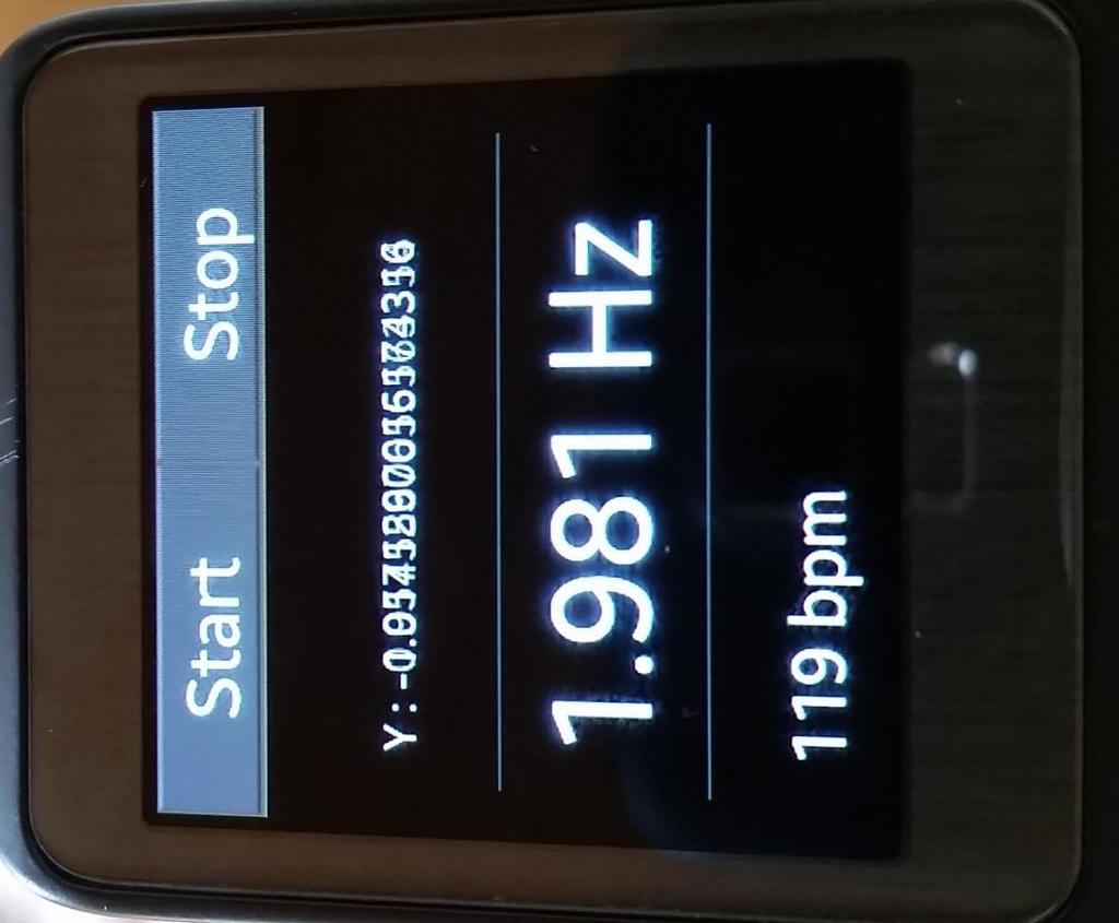 3. System development 11 Figure 3.7: The screen of the smartwatch while running the application. The middle line shows the resulting frequency of the FFT.