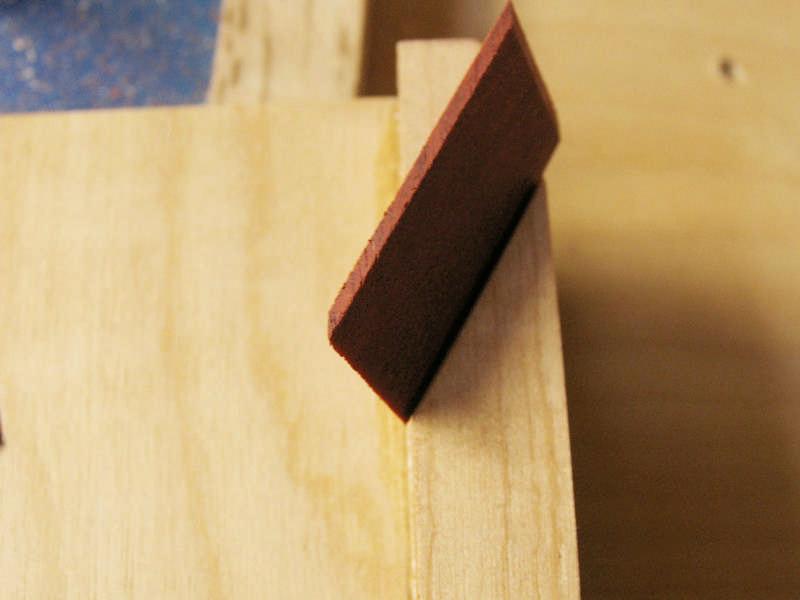 If the cut-off inlay slice falls into this groove (Below Right), it will not be restrained by the Hold-down. It will be grabbed and launched by the saw blade. This will get your attention!