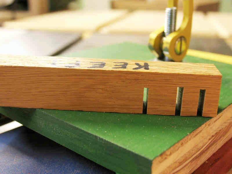 Cut a kerf half way through a scrap piece of material. Keep the piece of scrap to use to measure the inlay slices.
