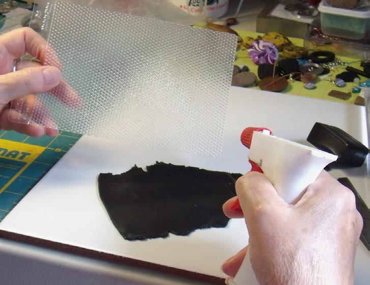 Using an acrylic roller, roll over the texture sheet once using firm pressure [8]. NOTE: Your pattern may distort if you roll back and forth over the clay.
