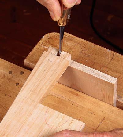 The case gets through-dovetailed in straightforward fashion except above the drawer opening, where the side has just two tails.