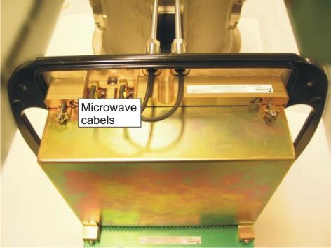 Remove the microwave cables from the sensor electronics with an