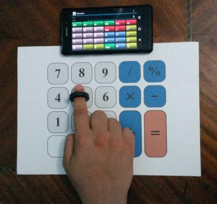 7 8 9 / % 4 5 6-2 + = (a) Larger keys. (b) Kids-friendly keyboard. (c) Calculator in brialle. Fig. : Using MagBoard with a sample calculator application.
