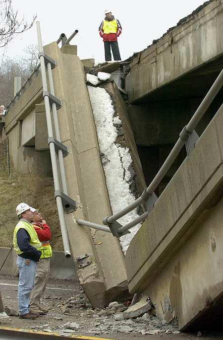 3 Figure 1.1 Pennsylvania Department of Transportation Engineers inspect the collapse of the Lake View Drive overpass on to I-70 [3].