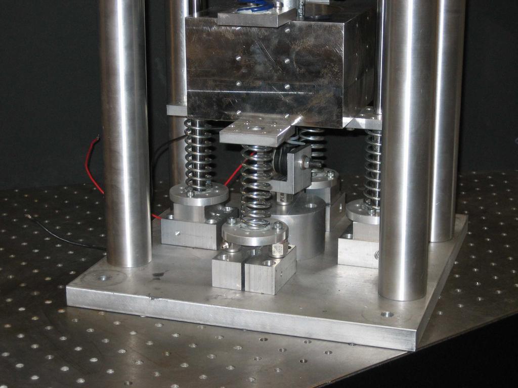74 One pieoelectric load cell measures the transmitted damper force Two pieoelectric load cells measure ¼ of the transmitted spring force Figure 4. The base plate arrangement of the FFS prototype.