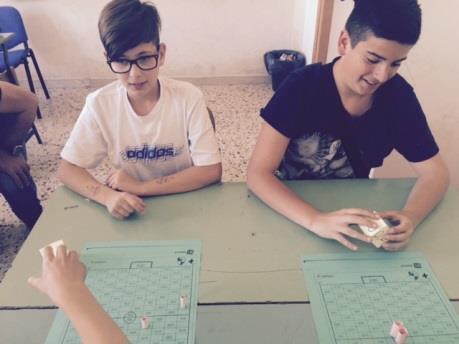 A game board like a football pitch is prepared.