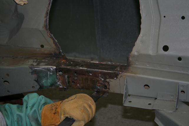 Remove all excess material, welds and paint from the main rails to all for the installation of the boxing plates.