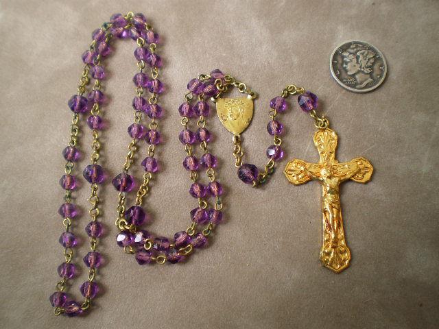 Sold for $125.00 Dainty Antique Gilt Brass and Violet Glass Rosary Sweet little antique rosary from the 1920s-1940s.